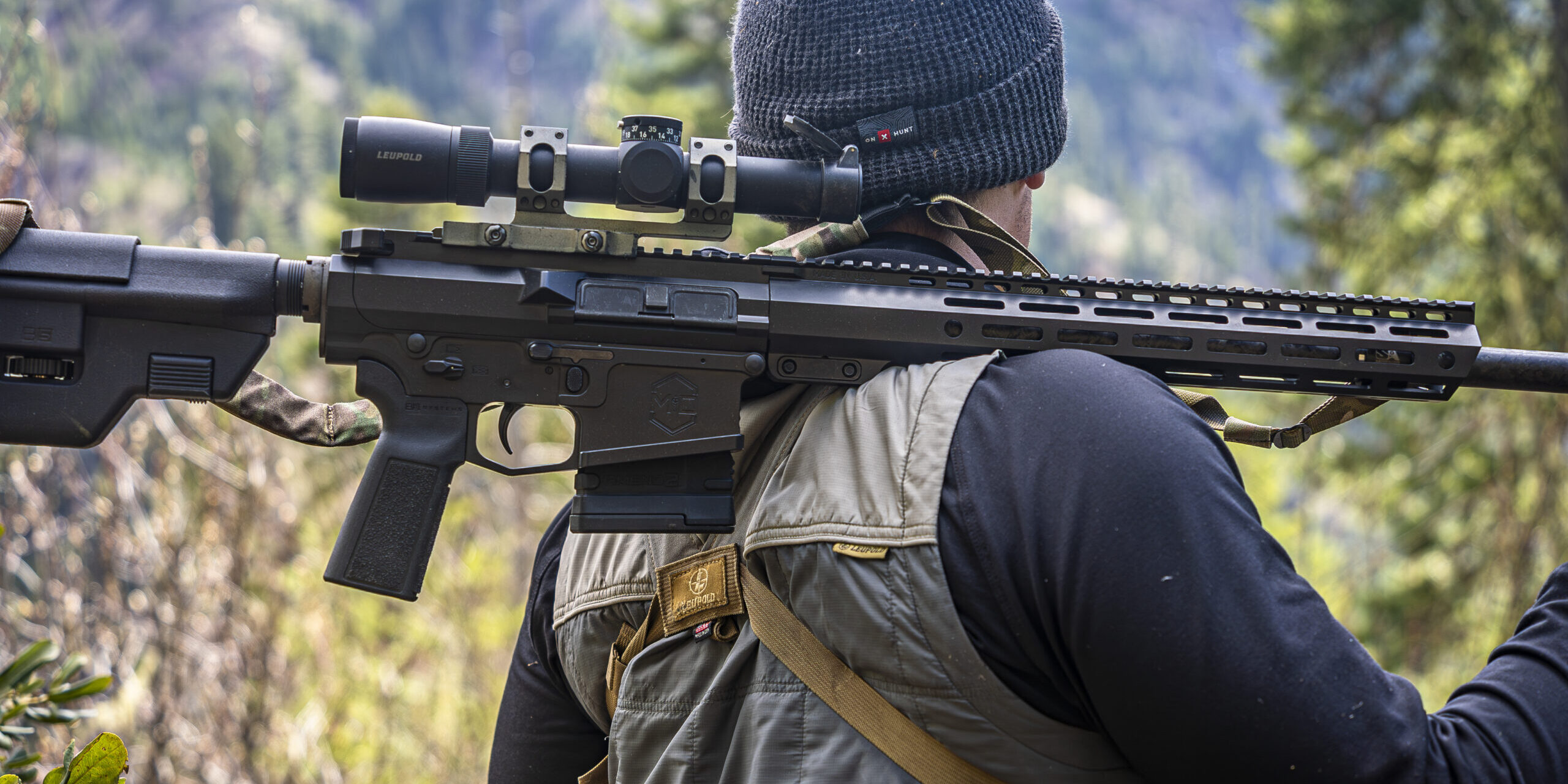 Caleb with mitchell defense rifle