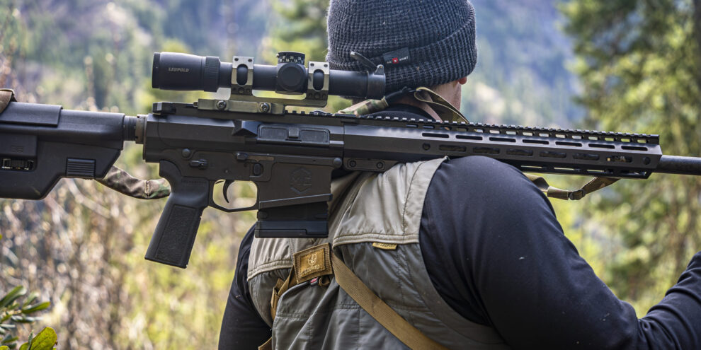 Caleb with mitchell defense rifle